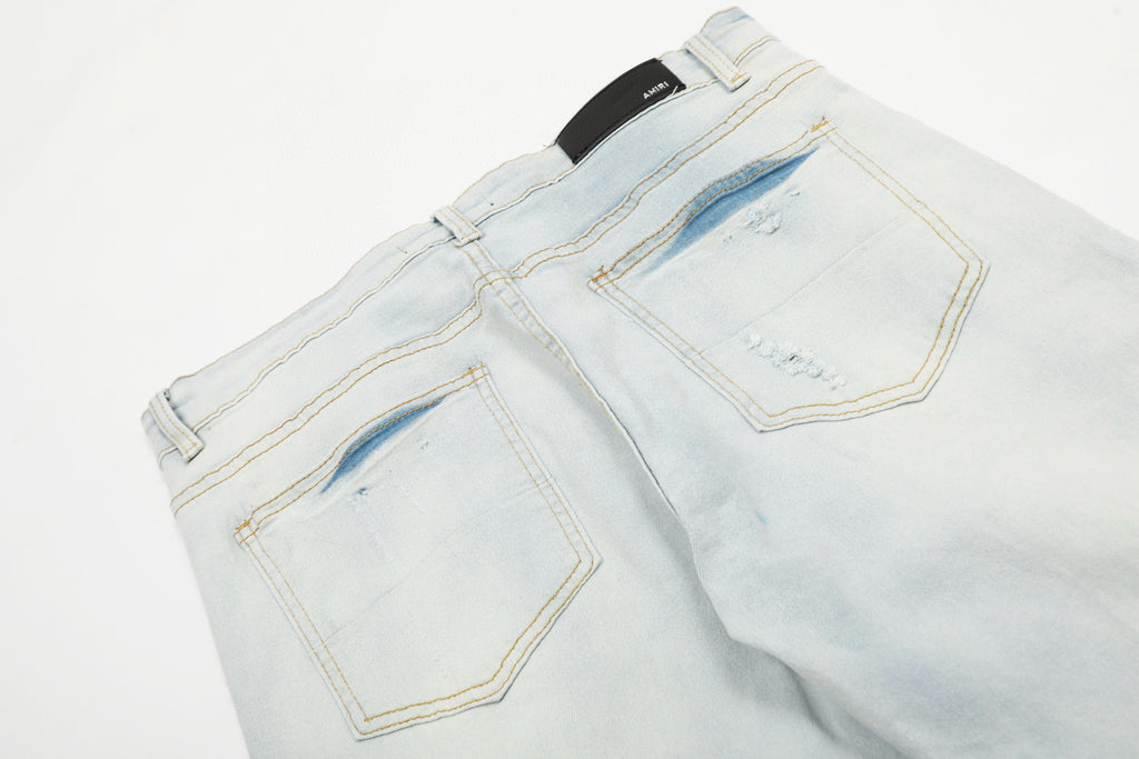Amiri | MX1 Leather Patch Distressed Jeans | Indigo