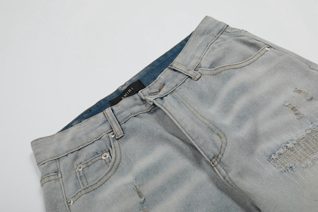 Amiri | MX1 Leather Patch Distressed Jeans | Indigo