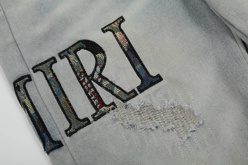 Amiri | MX1 Leather Patch Distressed Jeans | Indigo