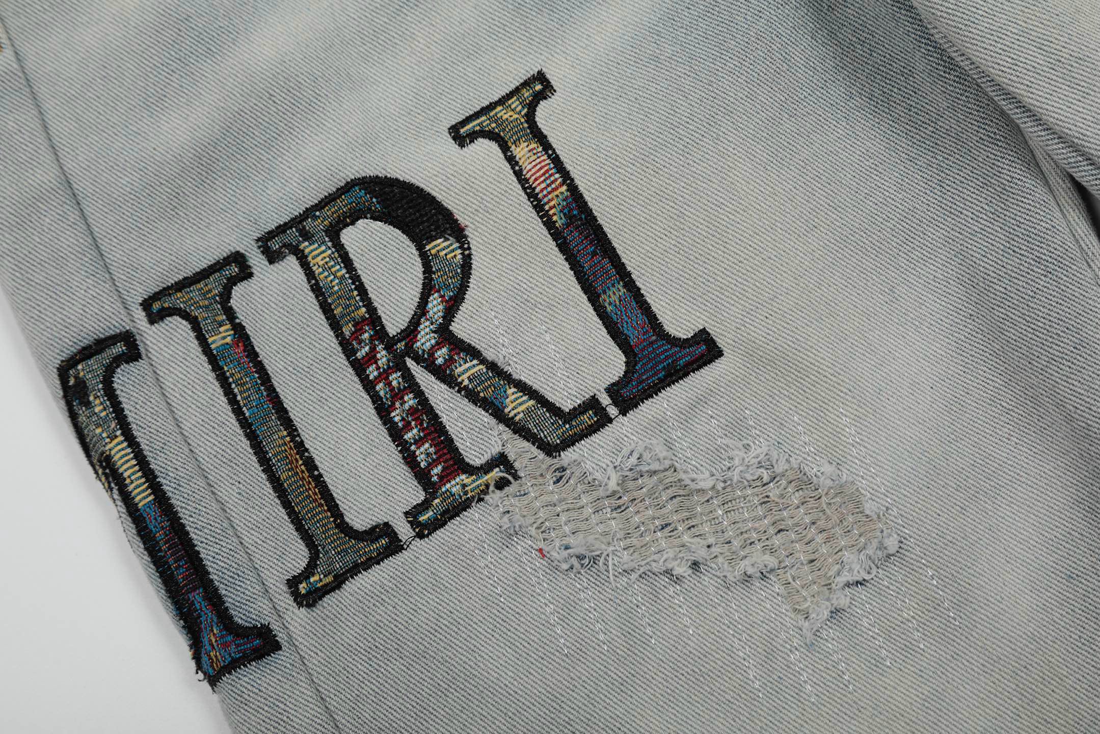 Amiri | MX1 Leather Patch Distressed Jeans | Indigo