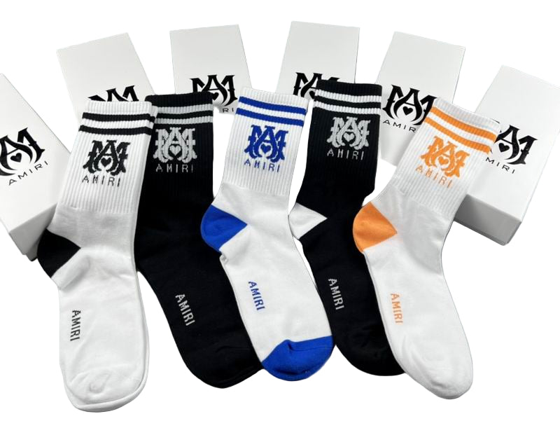 Set of socks with AMIRI branding on a white background