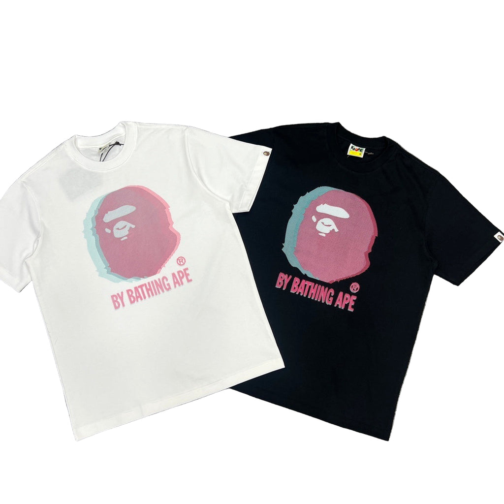 White and black t-shirts with 'By Bathing Ape' logo on a gray background